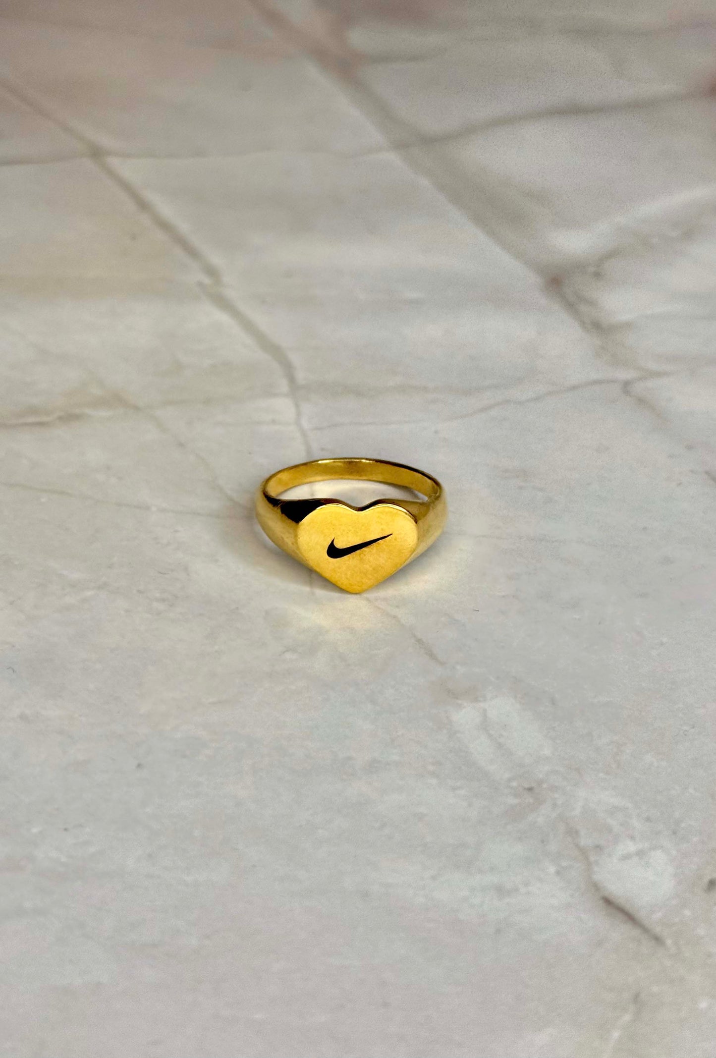 Heart Swoosh signet ring Goldie